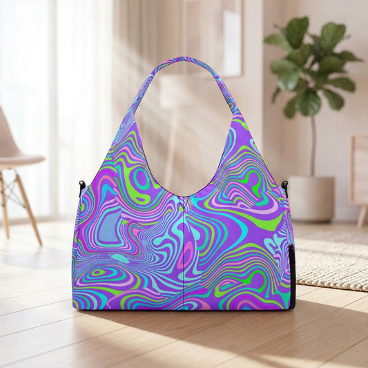 A colorful, patterned handbag with a vibrant, swirling design is displayed on a wooden floor in a room with a potted plant and a chair visible in the background.