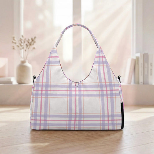 A white handbag with a plaid pattern is displayed on a wooden surface, with a window and some books visible in the background.