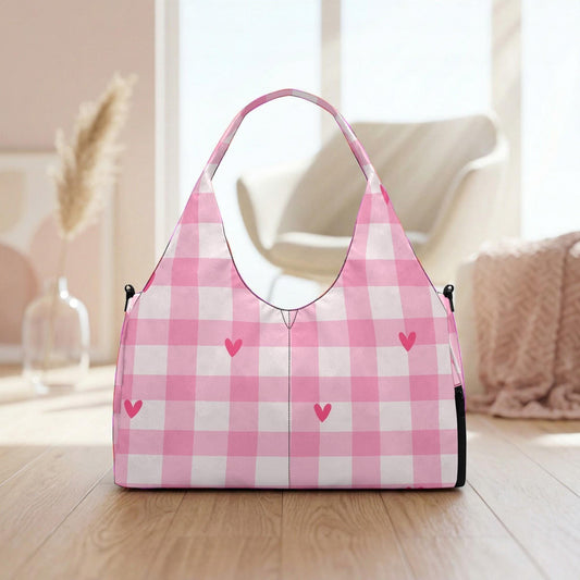 A pink and white gingham handbag with heart-shaped embellishments is placed on a wooden surface, with a vase and a chair visible in the background.