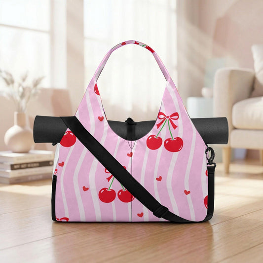 A pink tote bag with a pink and white striped pattern and red cherries printed on it, placed on a wooden floor in a room with a couch and a vase.