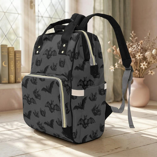 Baby Bat-print backpack in a three-quarter front view