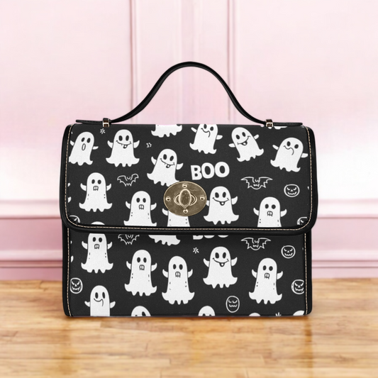 a black and white bag with a pattern of ghost on it
