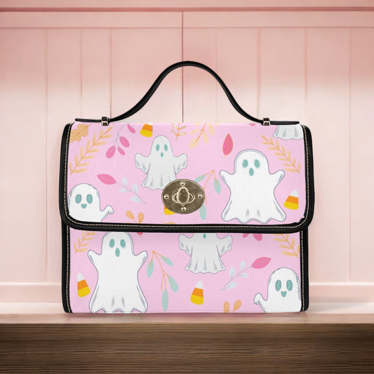 a pink bag with ghost on it sitting on a table
