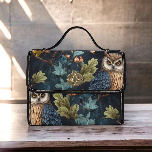 a handbag with an owl design on it