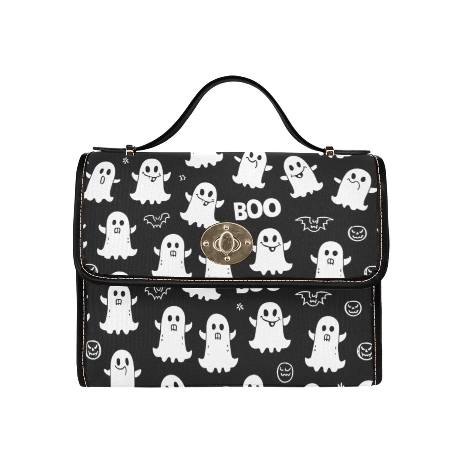 a black and white bag with white ghost print