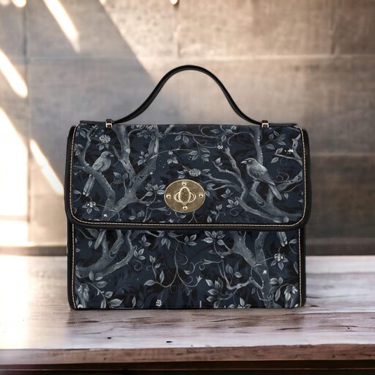 a black floral purse sitting on top of a wooden table