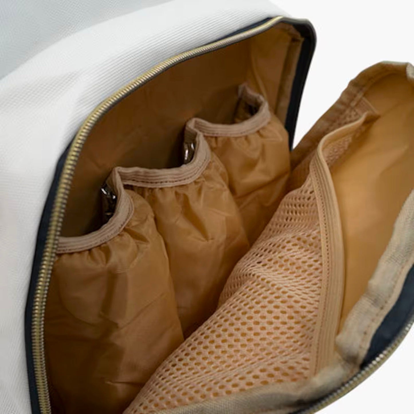 a close up of a bag with shoes inside of it