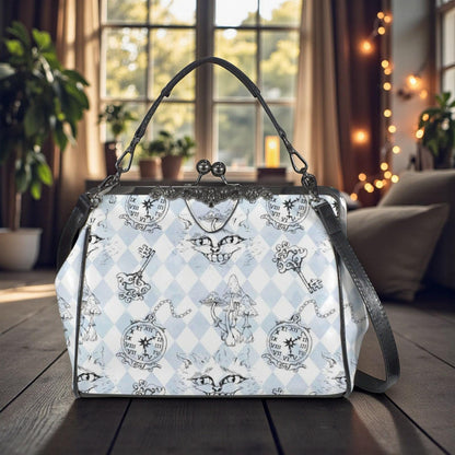 A handbag with a whimsical, cartoonish pattern of cats and clocks printed on it, placed on a wooden surface in front of a window with string lights.