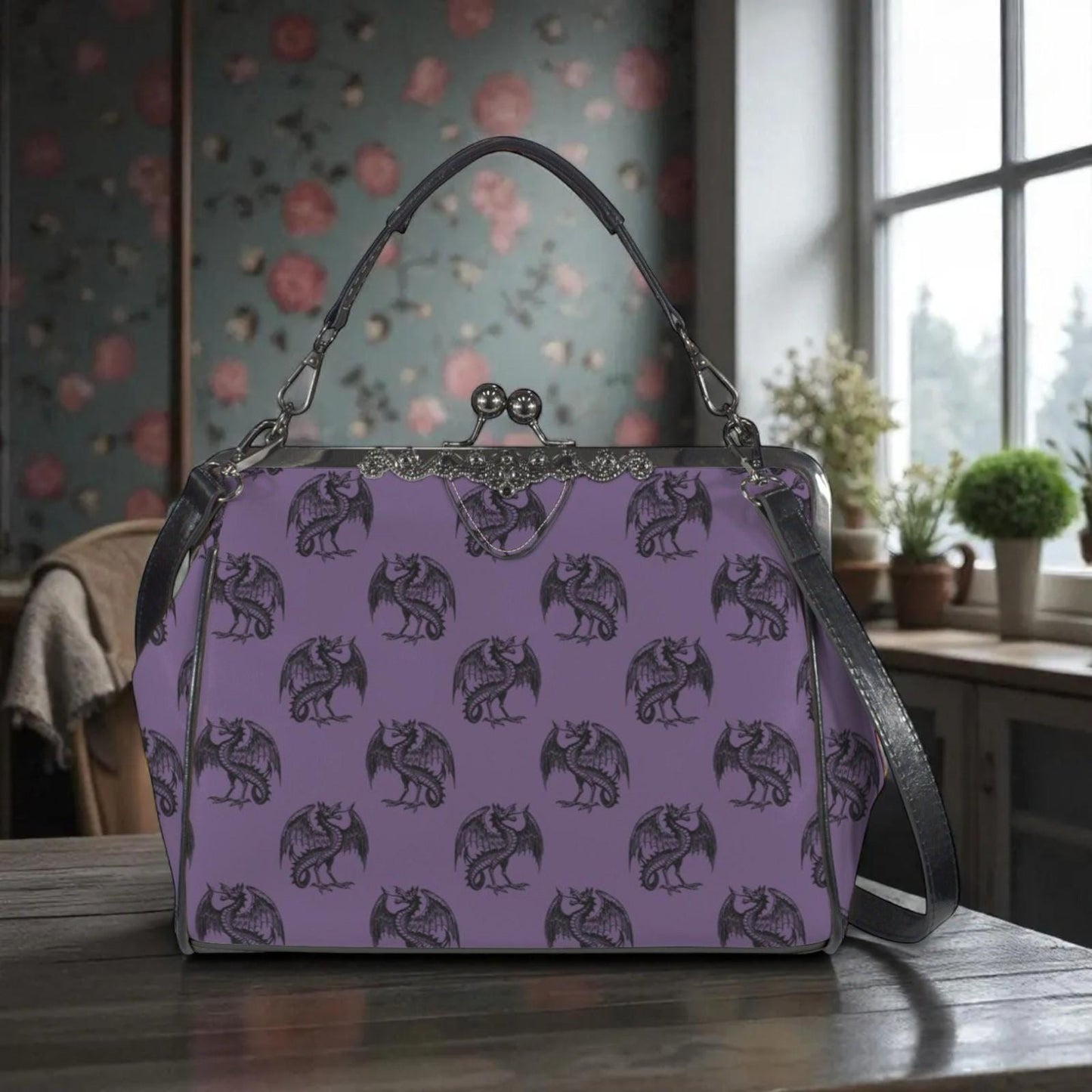 A purple handbag with a dragon pattern printed on it, sitting on a wooden surface.
