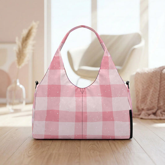 A pink and white checkered handbag is placed on a wooden floor, with a vase and a chair visible in the background.