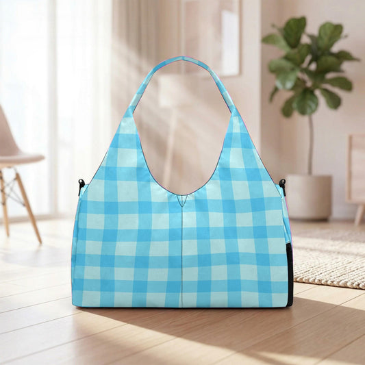 A blue and white checkered handbag is placed on a wooden floor in a room with a potted plant in the background.