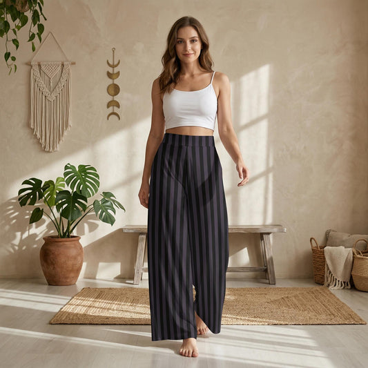 A woman wearing a white crop top and striped black pants stands in a room with a wooden bench, potted plant, and woven basket.
