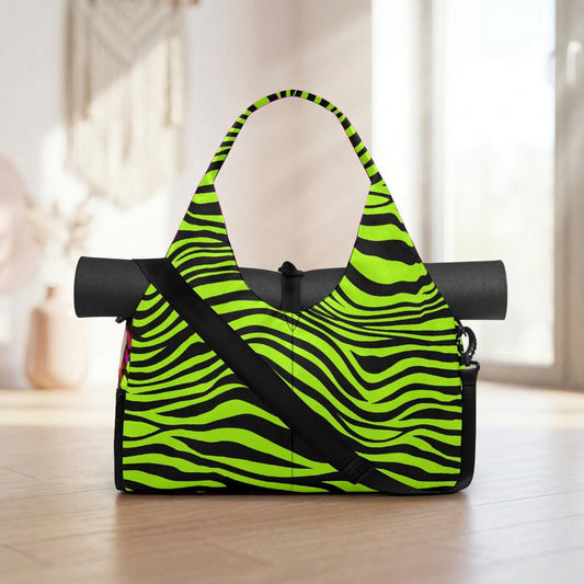 A bright green and black zebra-striped yoga bag is placed on a wooden floor, with a window and a vase visible in the background.