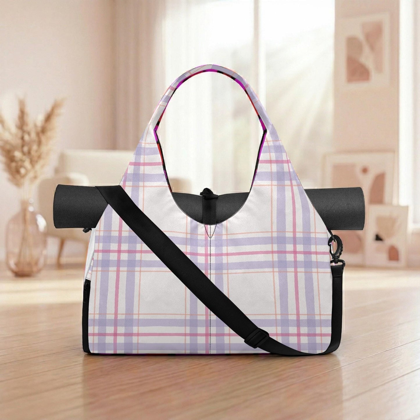 A plaid yoga bag with a black strap is placed on a wooden floor in a room with a window and a vase.