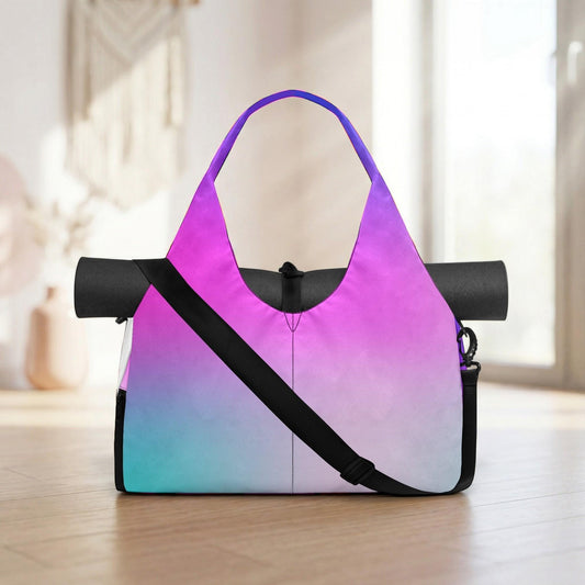 A colorful tote bag with a vibrant gradient of purple, pink, and blue colors, featuring a black strap and a yoga mat rolled up at the bottom.