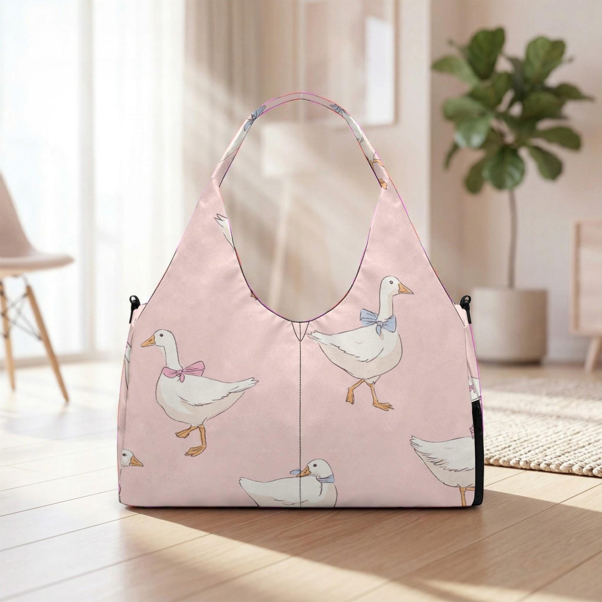 A pink handbag with a pattern of cartoon ducks printed on it, placed on a wooden floor in a room with a plant in the background.