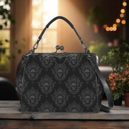 A black purse with a skull pattern printed on it, sitting on a wooden surface.