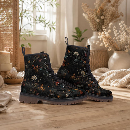 Black combat boots with dark floral artwork