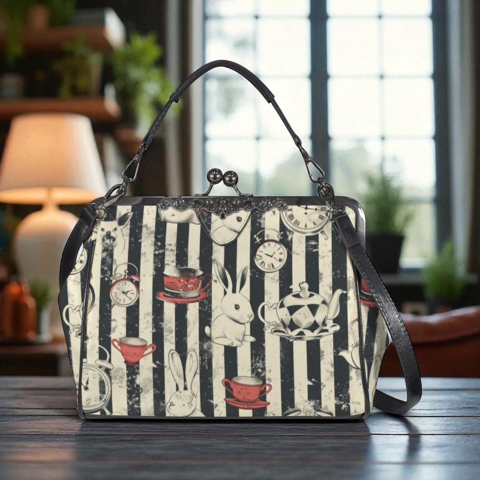 A handbag with a striped pattern and various whimsical illustrations, including a rabbit, teapots, cups, and clocks, is displayed on a wooden surface.