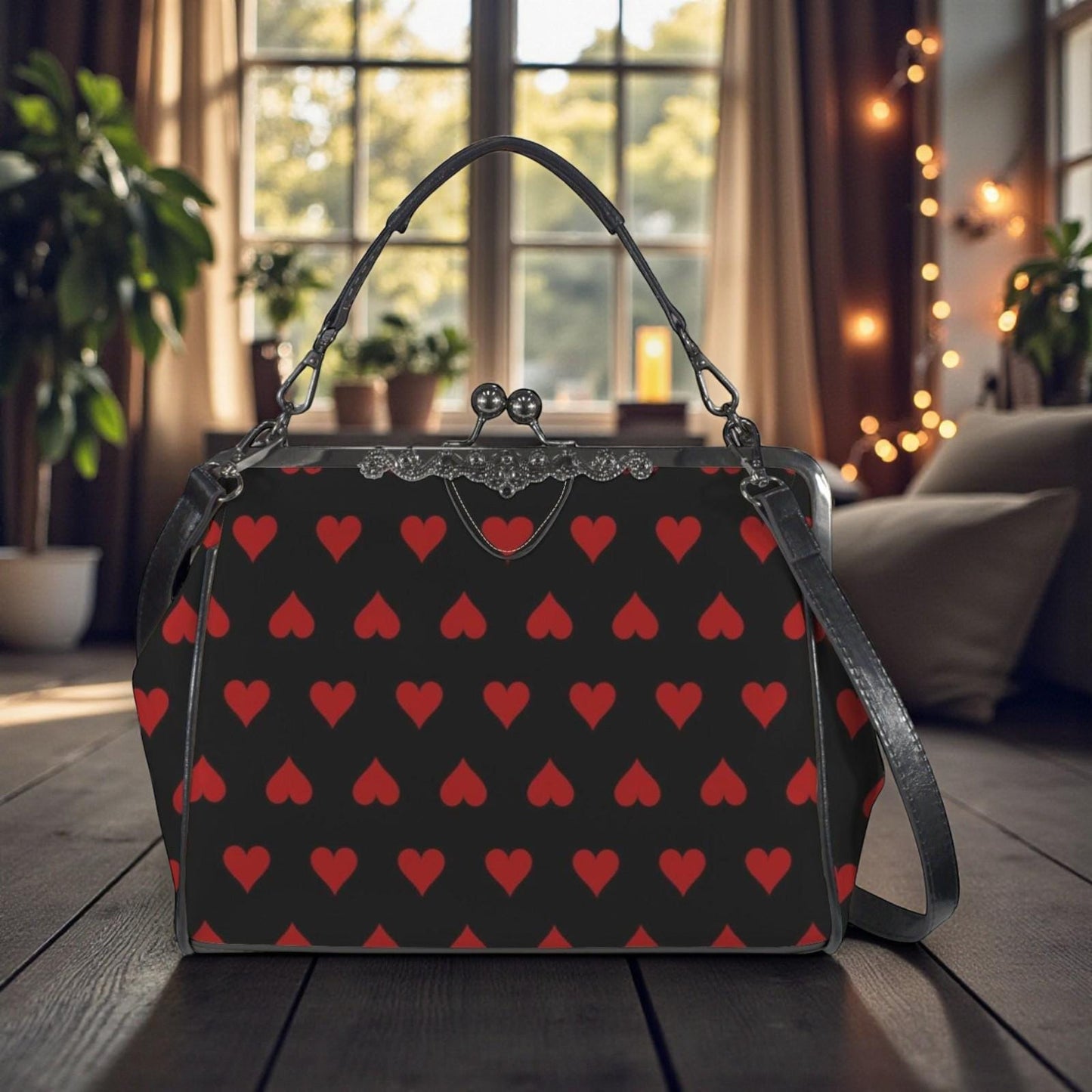 A black purse with a red heart pattern is displayed on a wooden surface, with a window and plants visible in the background.