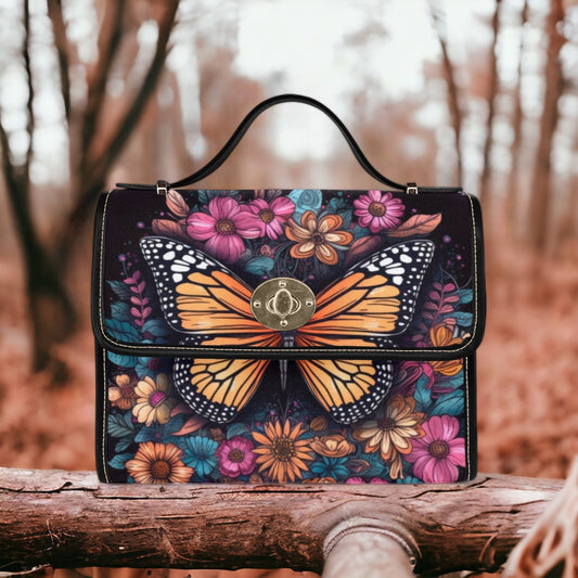 a colorful butterfly purse sitting on top of a wooden bench