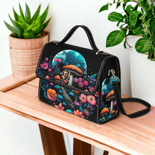 a black handbag with a picture of a bird on it