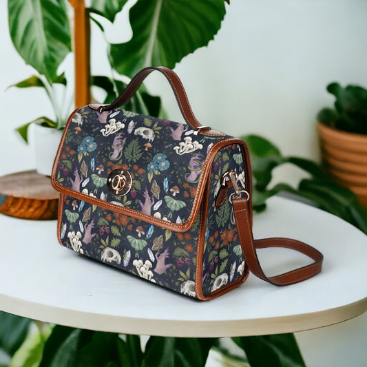 a purse sitting on top of a table next to a potted plant