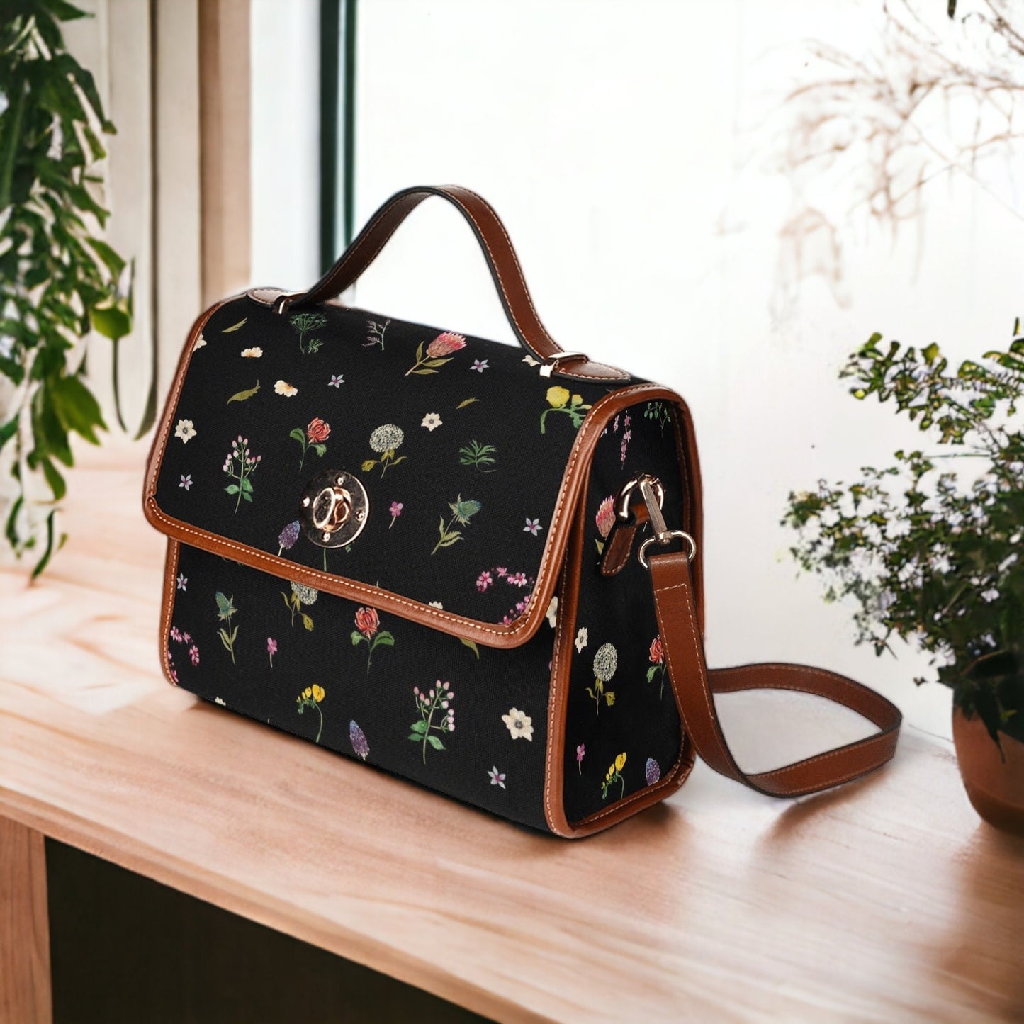 a purse sitting on a table next to a potted plant