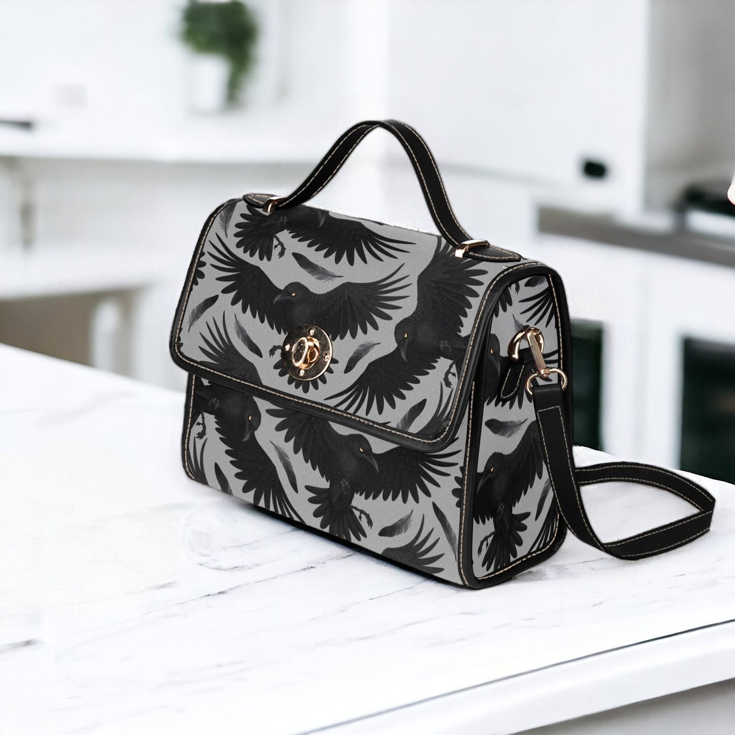 a black and white bag sitting on top of a counter