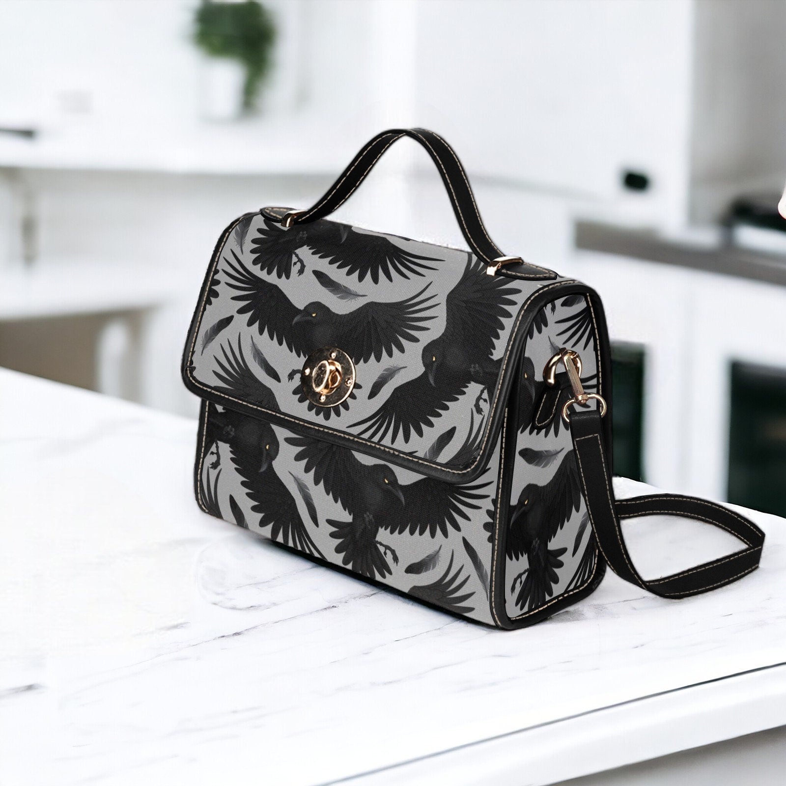a black and white bag sitting on top of a counter