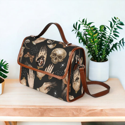 a handbag with a picture of a skeleton on it